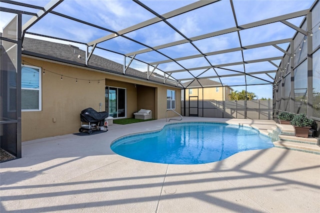 view of pool with a lanai and a patio area