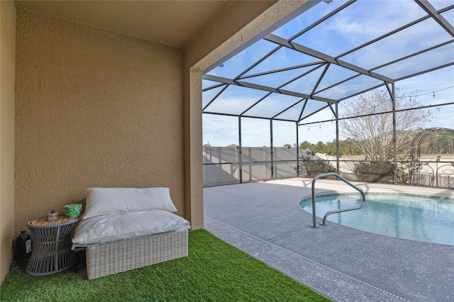 view of swimming pool with a lanai and a patio