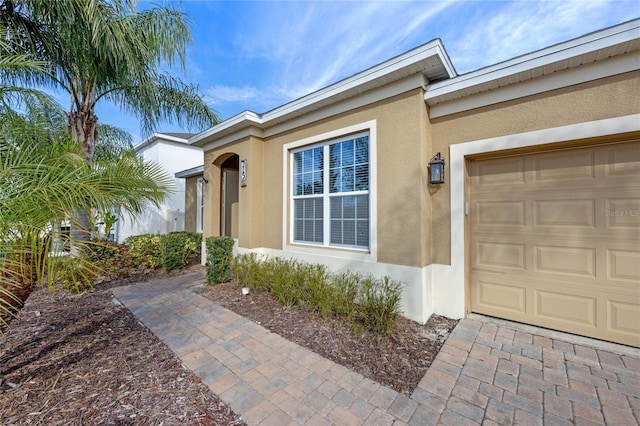 doorway to property featuring a garage