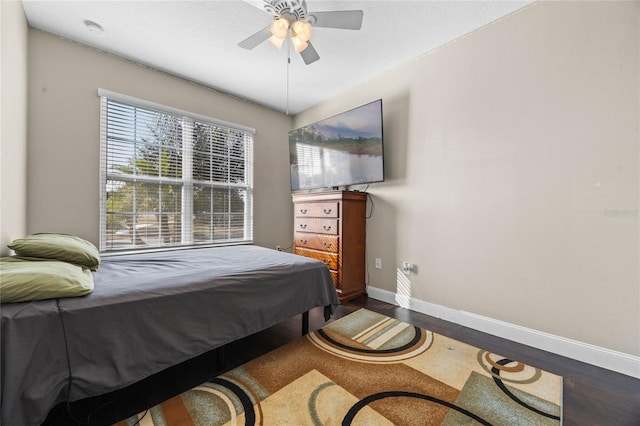 bedroom with wood-type flooring and ceiling fan