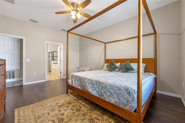 bedroom with ceiling fan, dark wood-type flooring, and ensuite bath