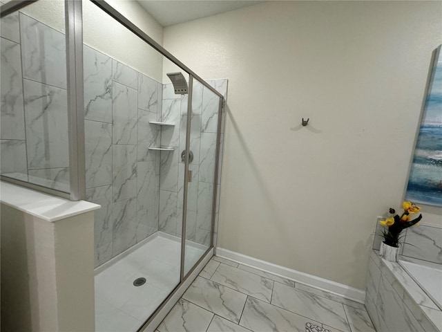 bathroom featuring a shower with door