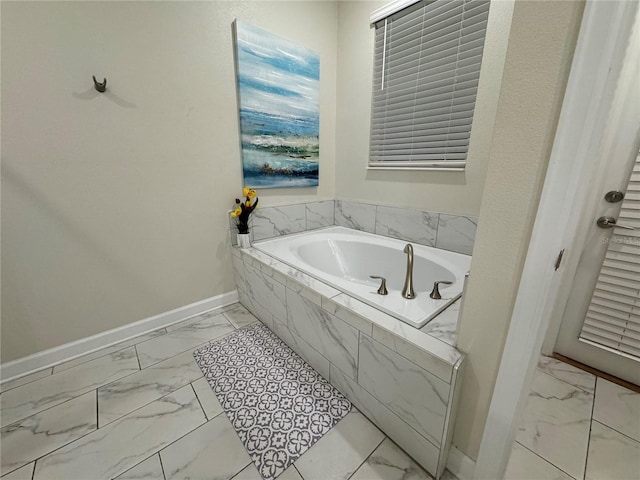 bathroom featuring tiled bath