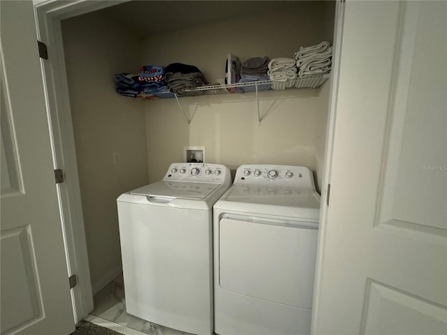 clothes washing area featuring washing machine and dryer