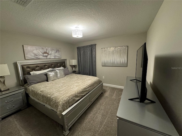 carpeted bedroom featuring a textured ceiling