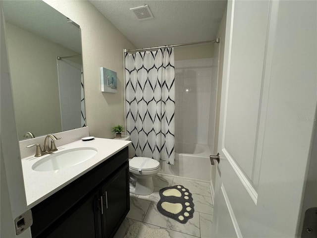 full bathroom featuring vanity, shower / tub combo, toilet, and a textured ceiling