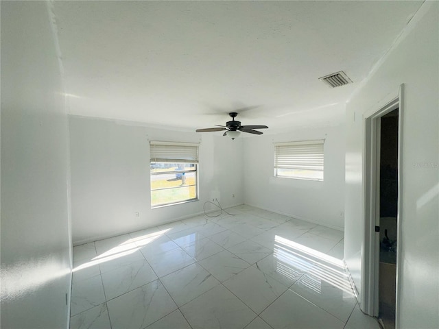 spare room featuring ceiling fan