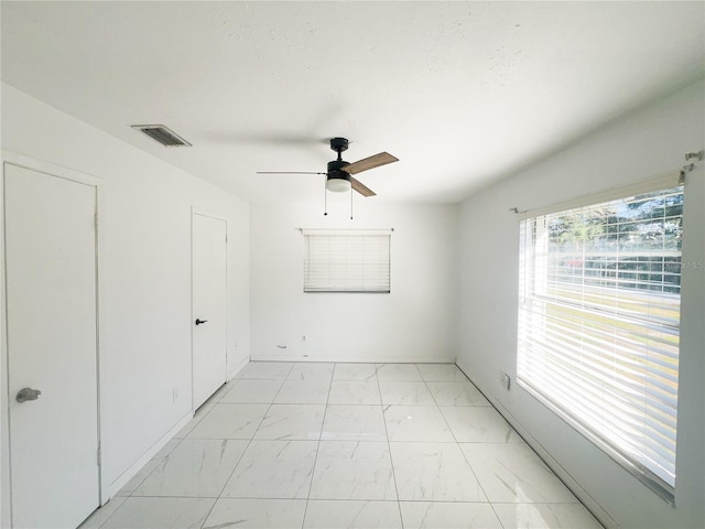 empty room with ceiling fan