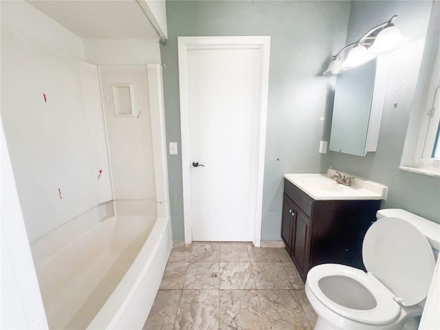 bathroom with a tub to relax in, vanity, and toilet