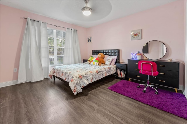 bedroom featuring dark hardwood / wood-style floors and ceiling fan