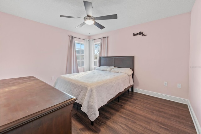 bedroom featuring dark hardwood / wood-style floors and ceiling fan