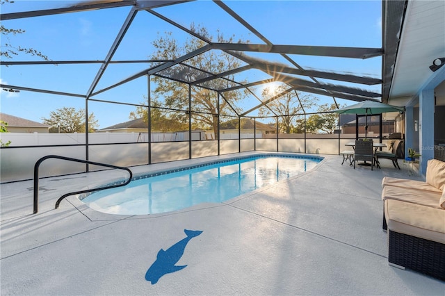 view of swimming pool with a lanai and a patio