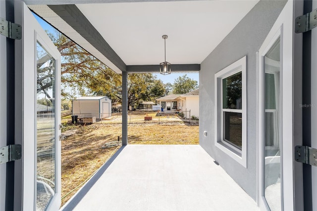 view of patio with a storage unit