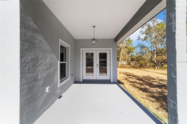 doorway to property featuring a patio and french doors