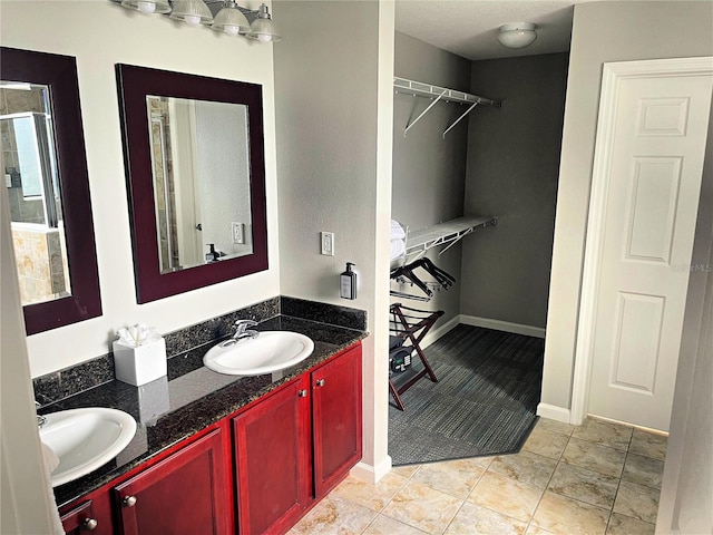 bathroom featuring vanity and tile patterned flooring