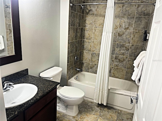 full bathroom featuring vanity, shower / tub combo with curtain, and toilet