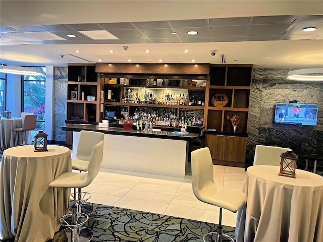 bar with light tile patterned floors