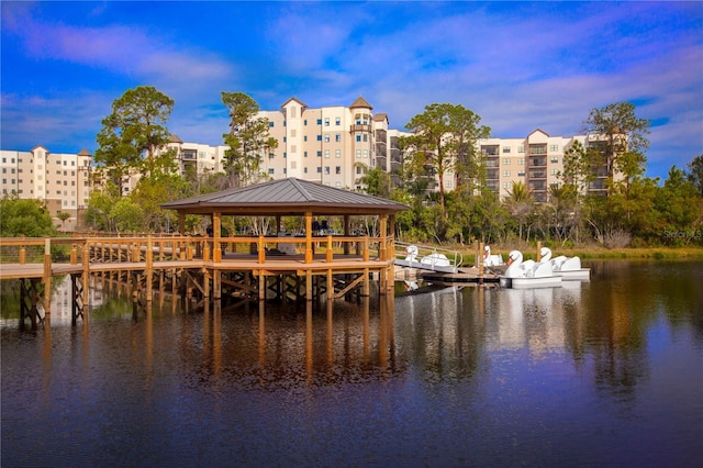 view of dock featuring a water view and a gazebo