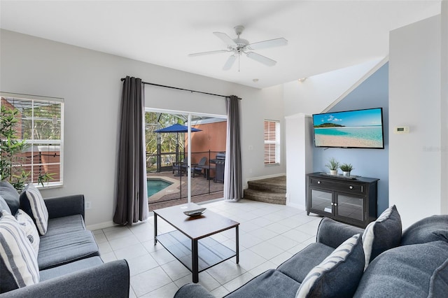 tiled living room with ceiling fan