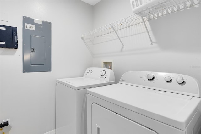 clothes washing area with independent washer and dryer and electric panel