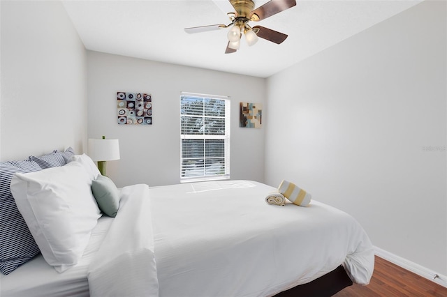 bedroom featuring hardwood / wood-style flooring and ceiling fan