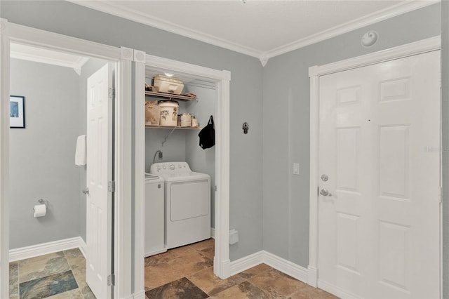 laundry area featuring ornamental molding and separate washer and dryer