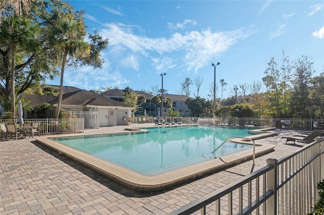 view of swimming pool with a patio