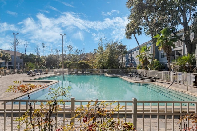 view of swimming pool with a patio area