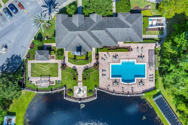 birds eye view of property with a water view