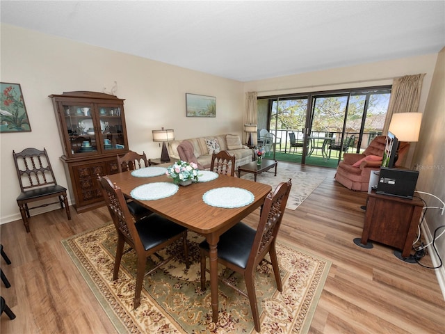 dining room with light hardwood / wood-style flooring