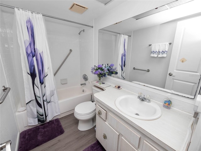 full bathroom with vanity, toilet, shower / tub combo, and hardwood / wood-style floors