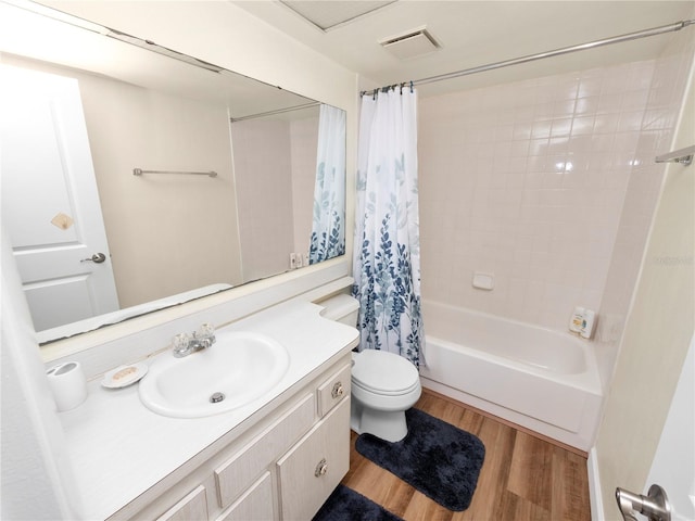 full bathroom with hardwood / wood-style flooring, vanity, toilet, and shower / bath combination with curtain