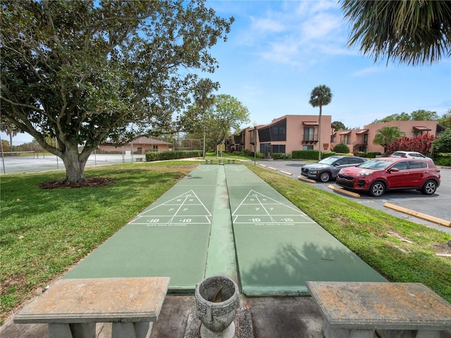 view of community featuring a yard