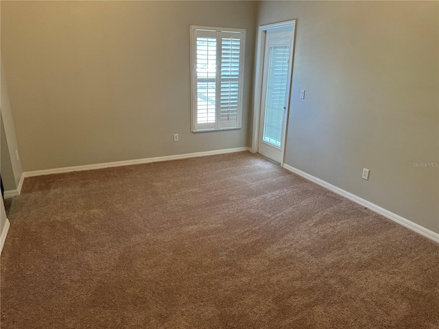 unfurnished room featuring carpet floors