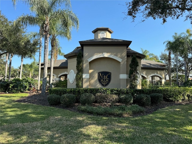 view of home's exterior with a lawn