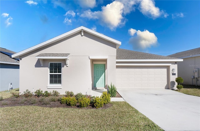 view of front of house with a garage and a front lawn