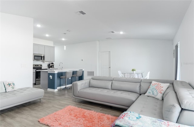 living room with light hardwood / wood-style flooring