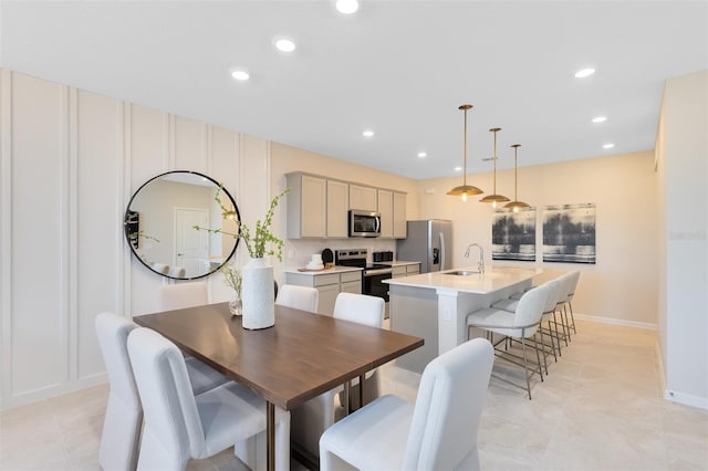 dining room featuring sink