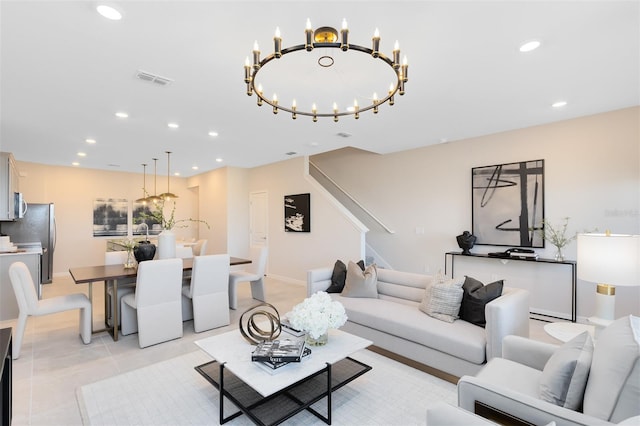 living room featuring light tile patterned floors and an inviting chandelier