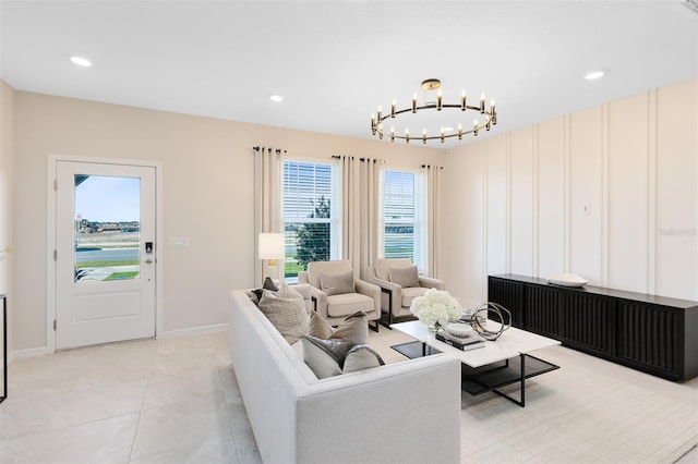 tiled living room featuring a notable chandelier