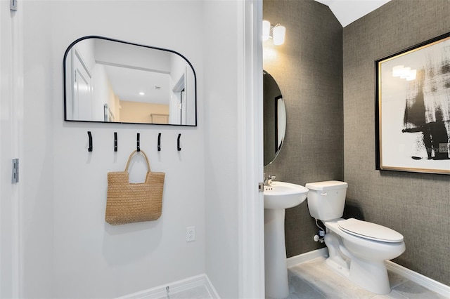 bathroom featuring tile patterned floors and toilet