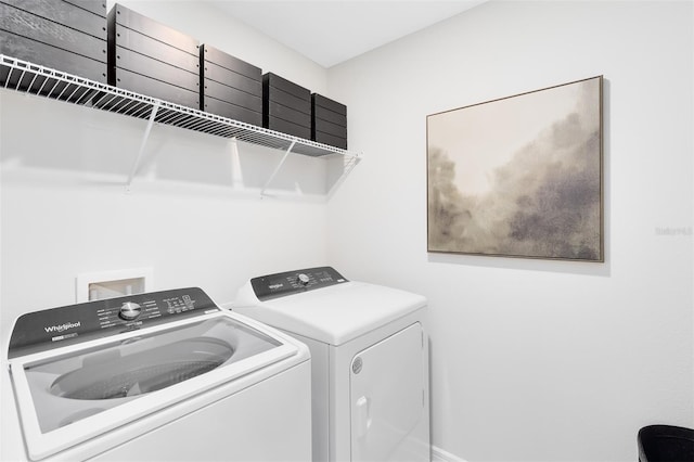 laundry area with washing machine and dryer