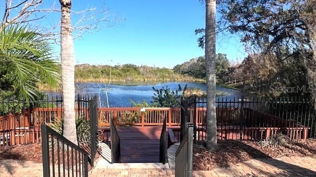 wooden deck featuring a water view