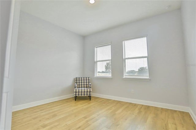 unfurnished room with light wood-type flooring