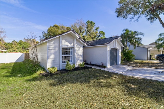 ranch-style house featuring an outbuilding and a front yard