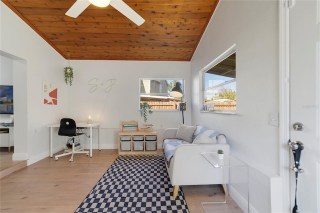 living room with wood ceiling, vaulted ceiling, light hardwood / wood-style floors, and ceiling fan