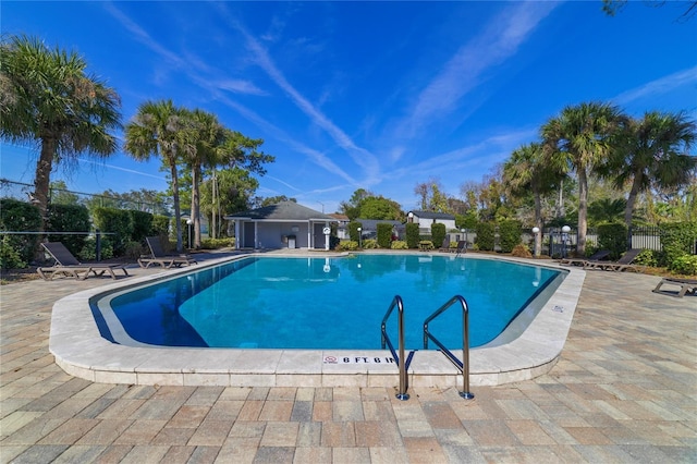 view of swimming pool with a patio area