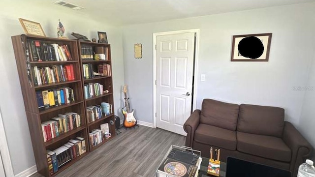 living area with hardwood / wood-style floors