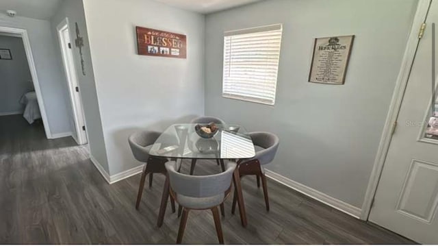 dining room with dark hardwood / wood-style floors