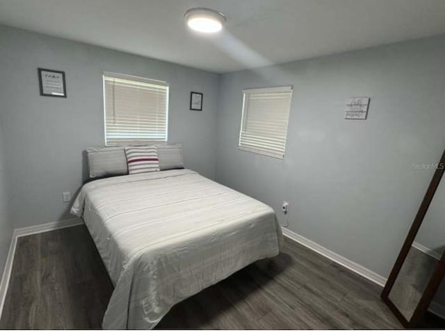 bedroom featuring dark hardwood / wood-style flooring